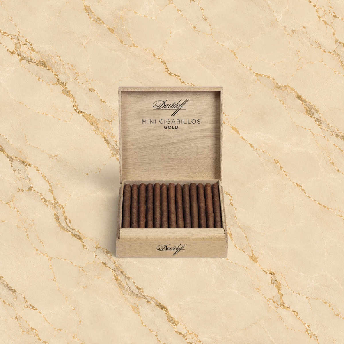 Arcadia Cigars Church Street Davidoff Mini Cigarillos Gold in an open wooden box on a green marble background.